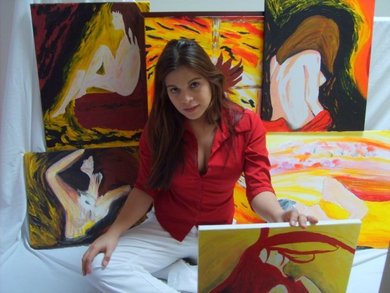 Mary Avina with her paintings